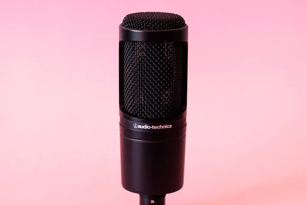 Audio technica at20335 microphone on pink backdrop.