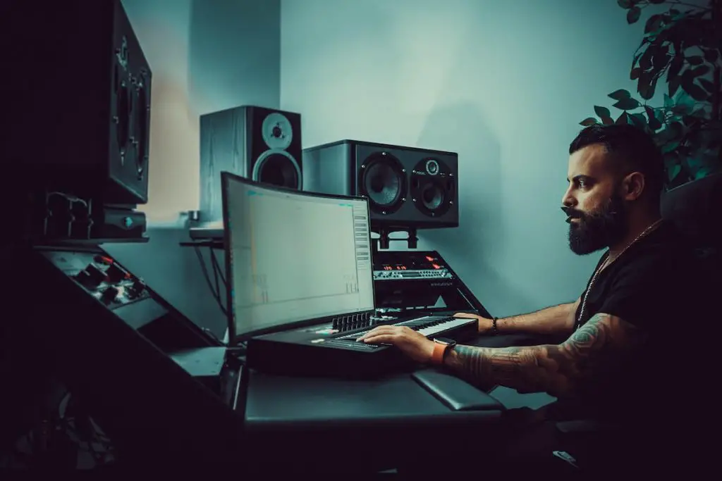 Home - bearded man mixes at home recording studio need studio monitors - audio apartment