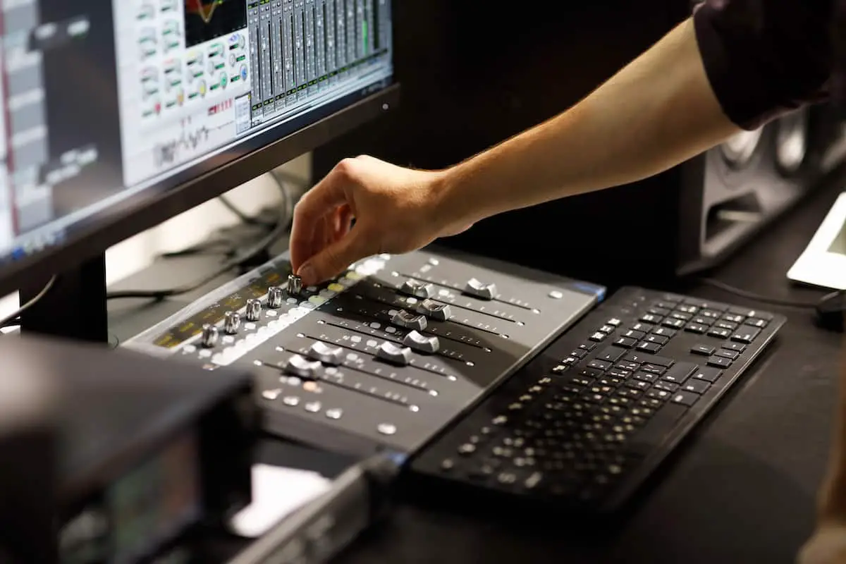 Home | man mixing music on desktop at home recording studio | audio apartment