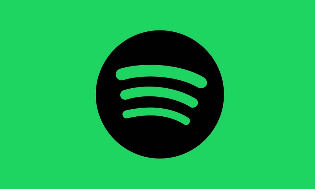 Image of a spotify icon with a green background. Source: spotify, pixabay