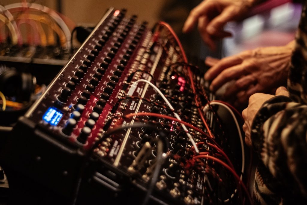 Image of an audio mixer with audio snake cable connected to it. Source: tstudio, pexels