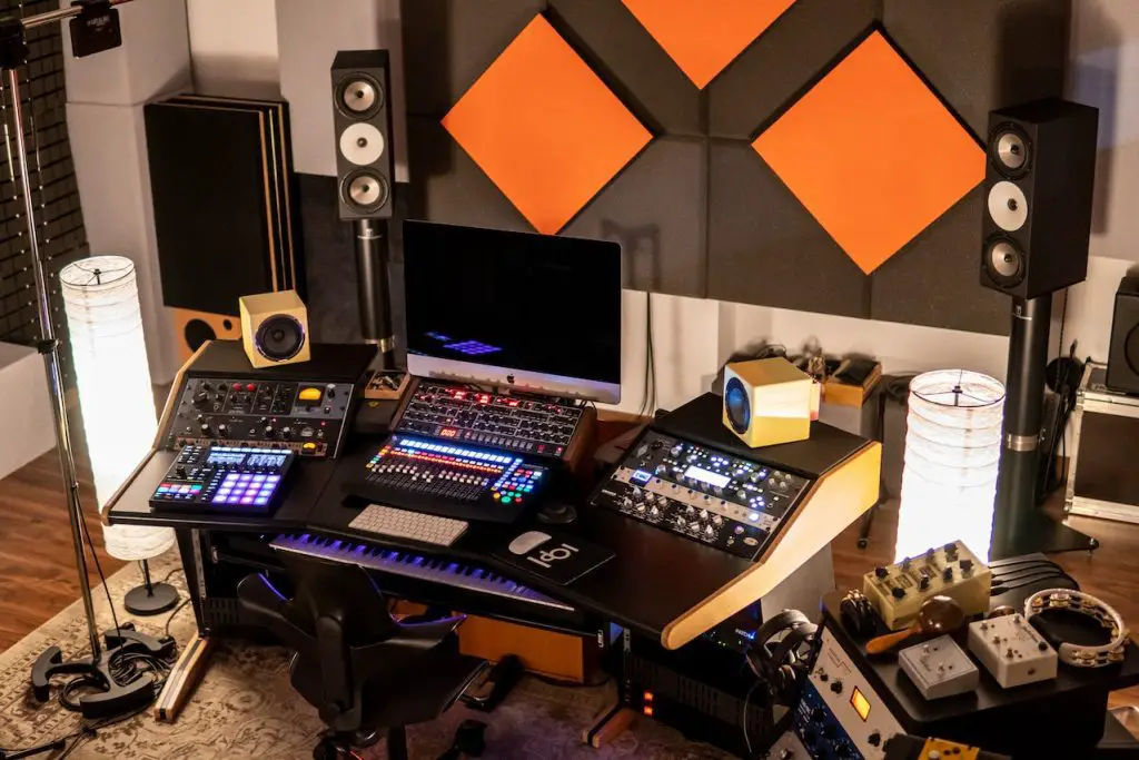 A home recording studio setup with audio mixer, monitor, and speakers. Source: pexels