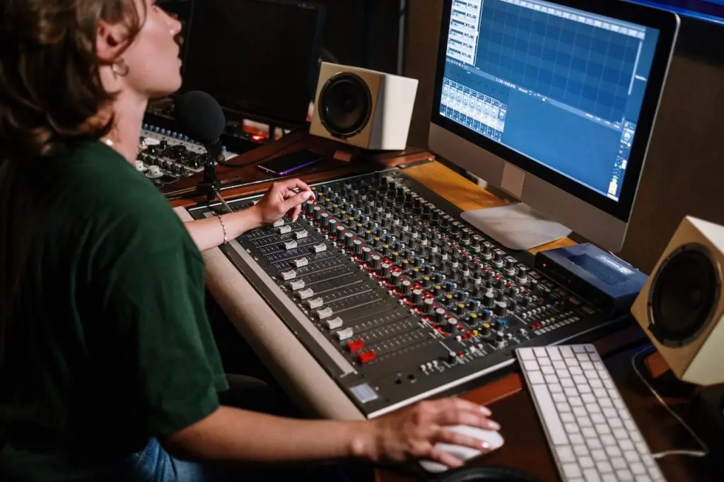 Image of someone using an audio mixer. Source: cottonbro studio, pexels