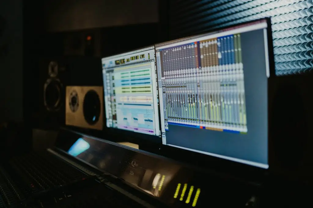 Image of two studio monitors inside a music studio. Source: tima miroshnichenko, pexels
