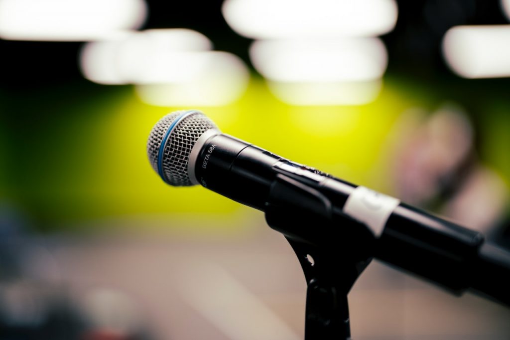 Image of a black and silver microphone on a stand. Source: jason morrison, pexels