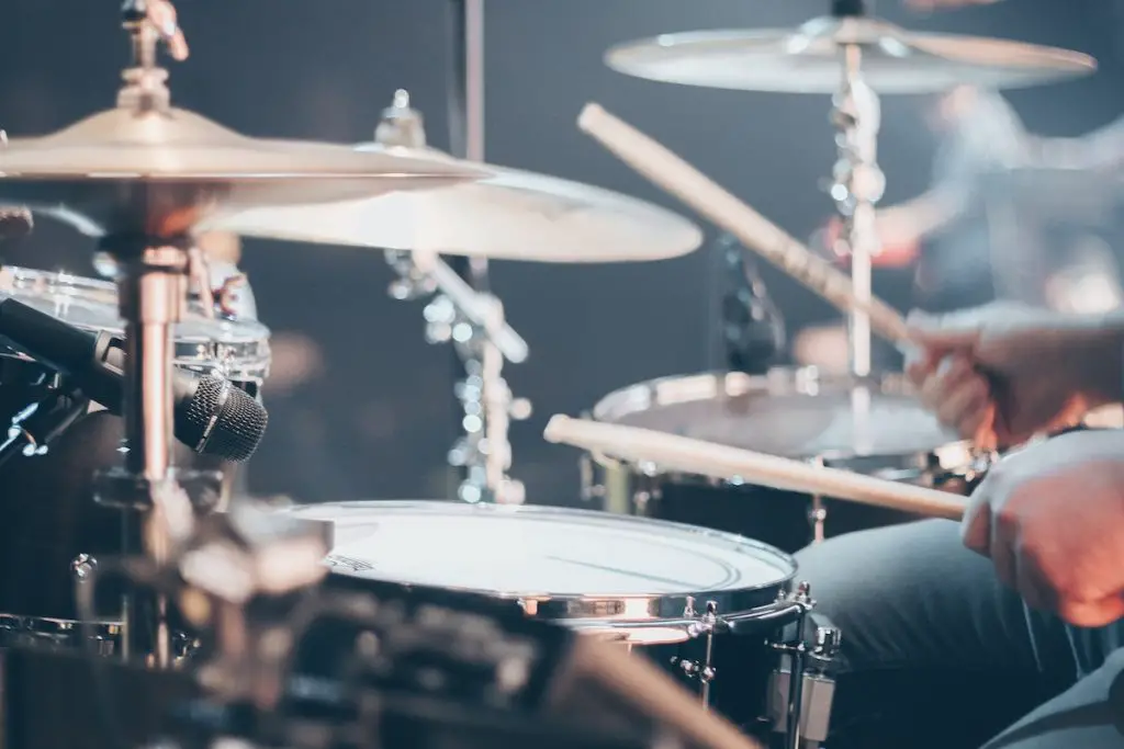 Image of a drummer playing drums. Source: pexels