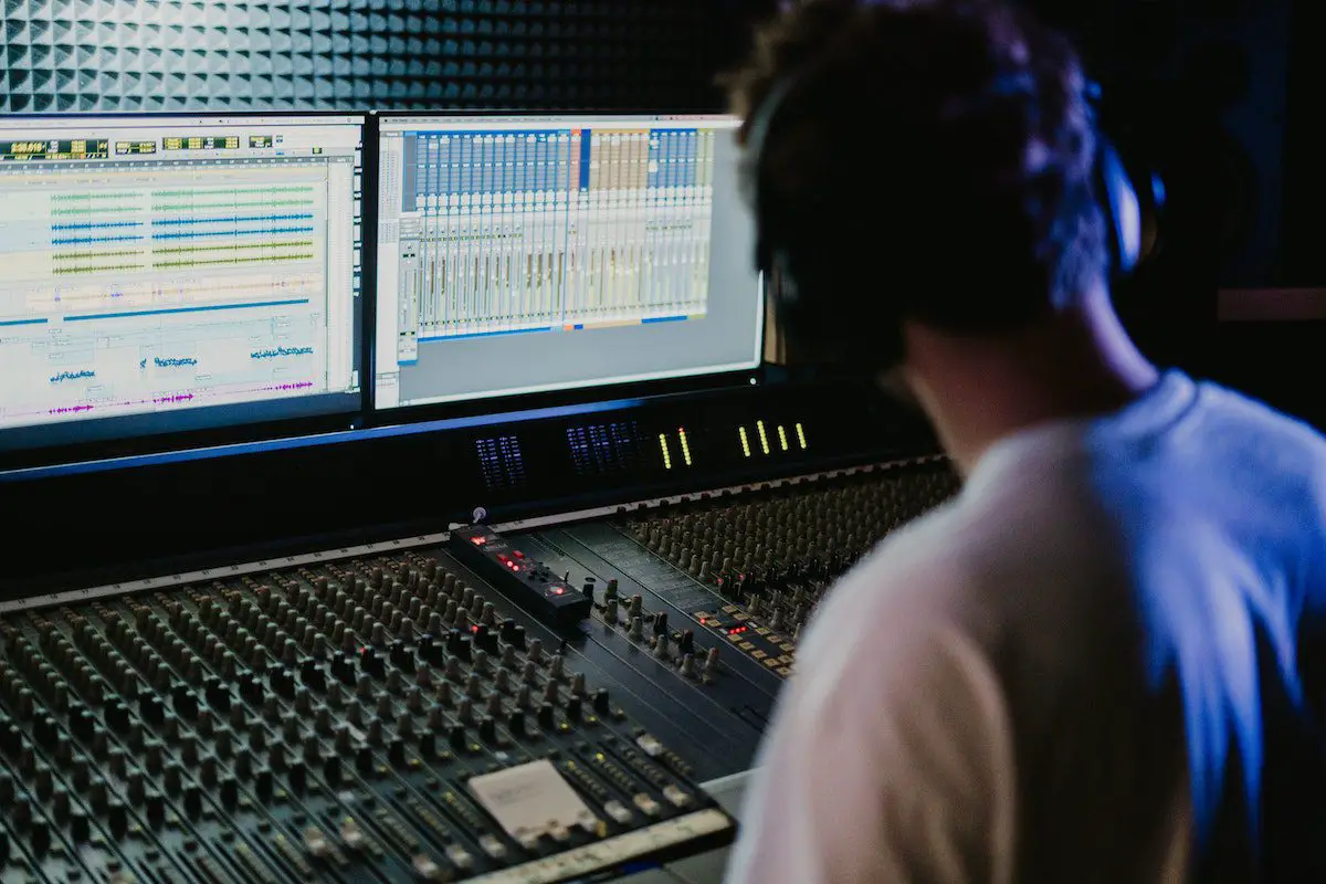 Image of a musician in a recording studio. Source: pexels