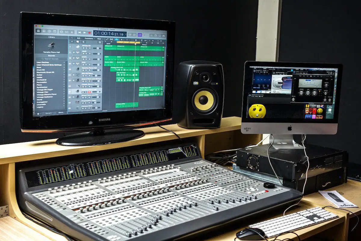Image of an audio control panel in a recording studio. Source: pexels