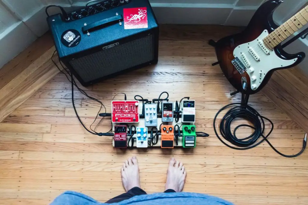 Image of guitar pedals connected to an amplifier and electric guitar. Source: unsplash