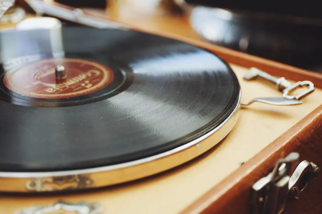 Close-up image of a vinyl record on a turntable. Source: unsplash