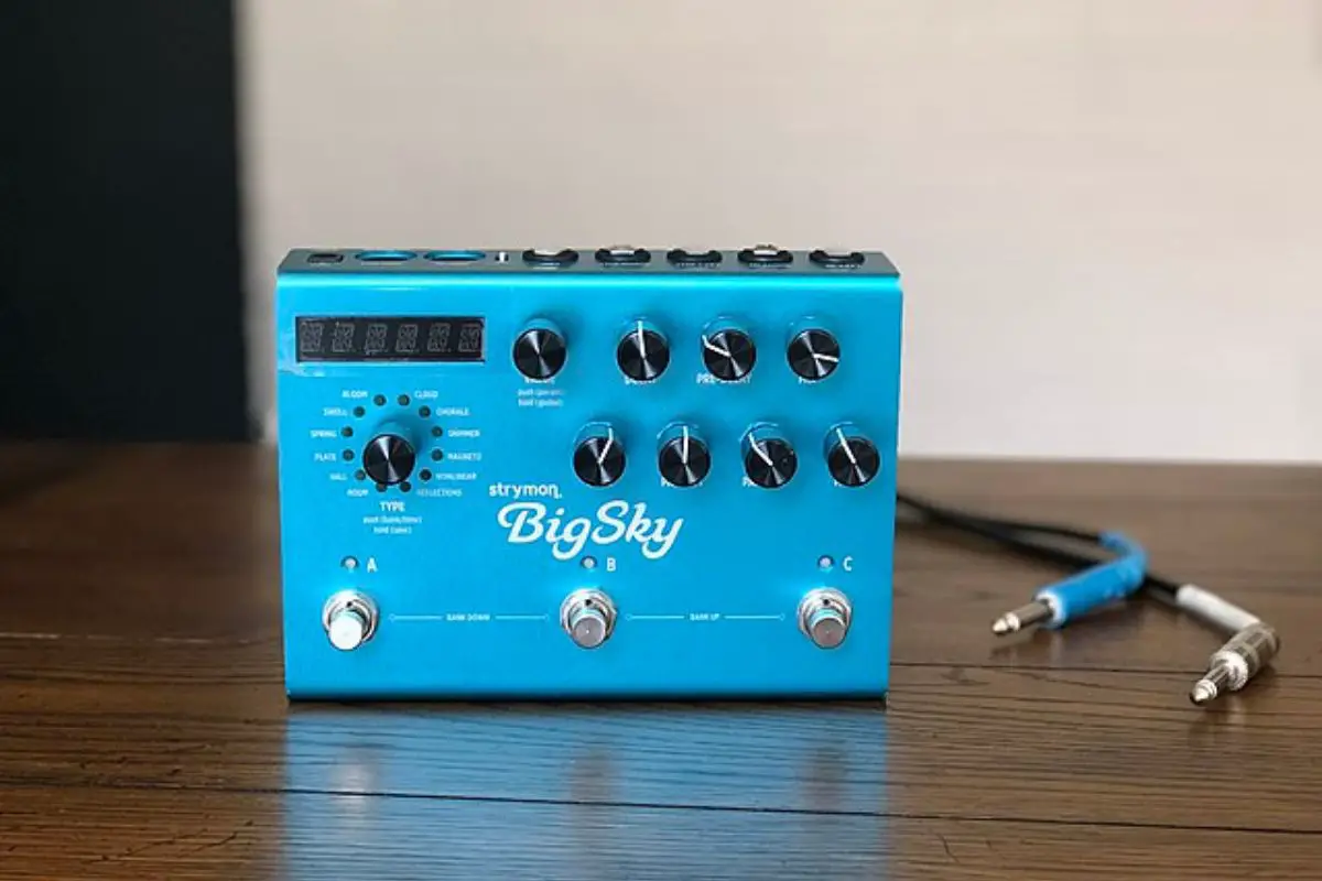 Image of a blue strymon bigsky reverb pedal on a wooden table. Source: Wiki Images