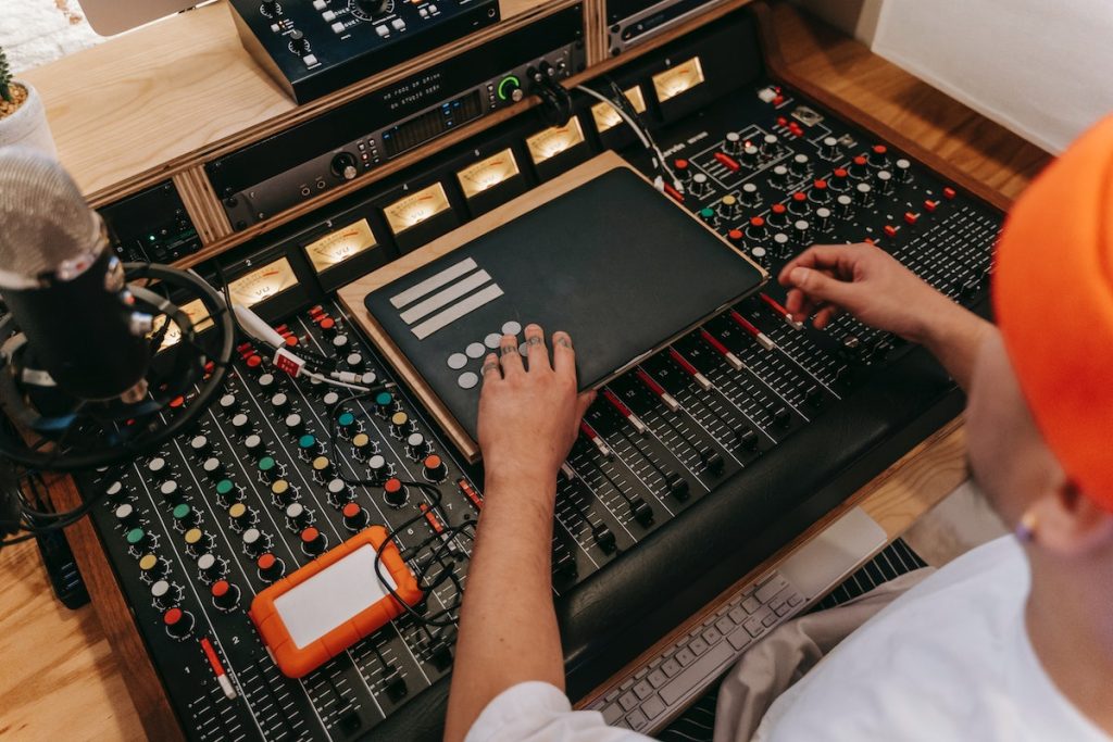 Image of a man using a sound mixer pexels