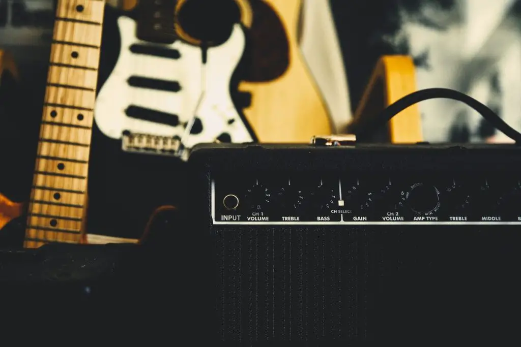 Image of guitars and an amplifier unsplash