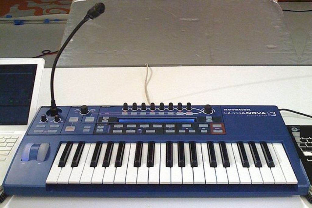 Image of a novation ultranova with vocoder microphone.