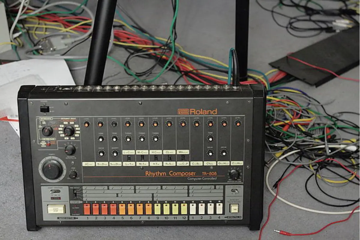 Image of a roland tr-808 in a audio production set up.