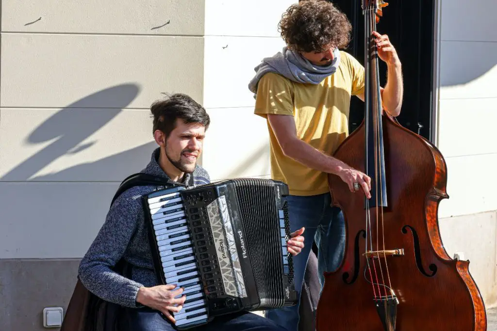 Image of two men playing musical instruments