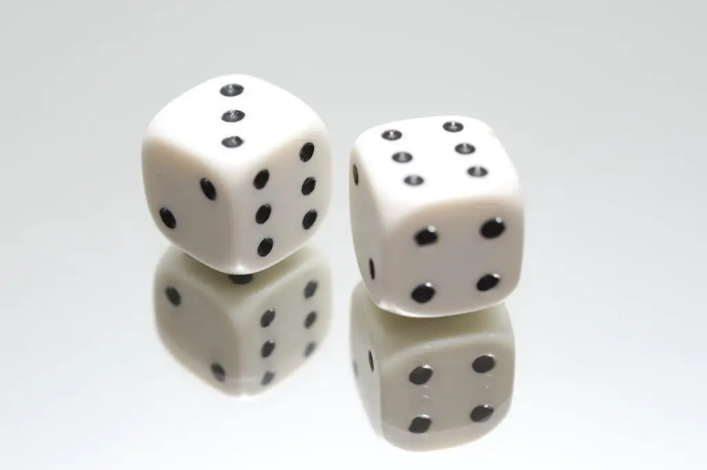 A pair of white dice. Source: pexels
