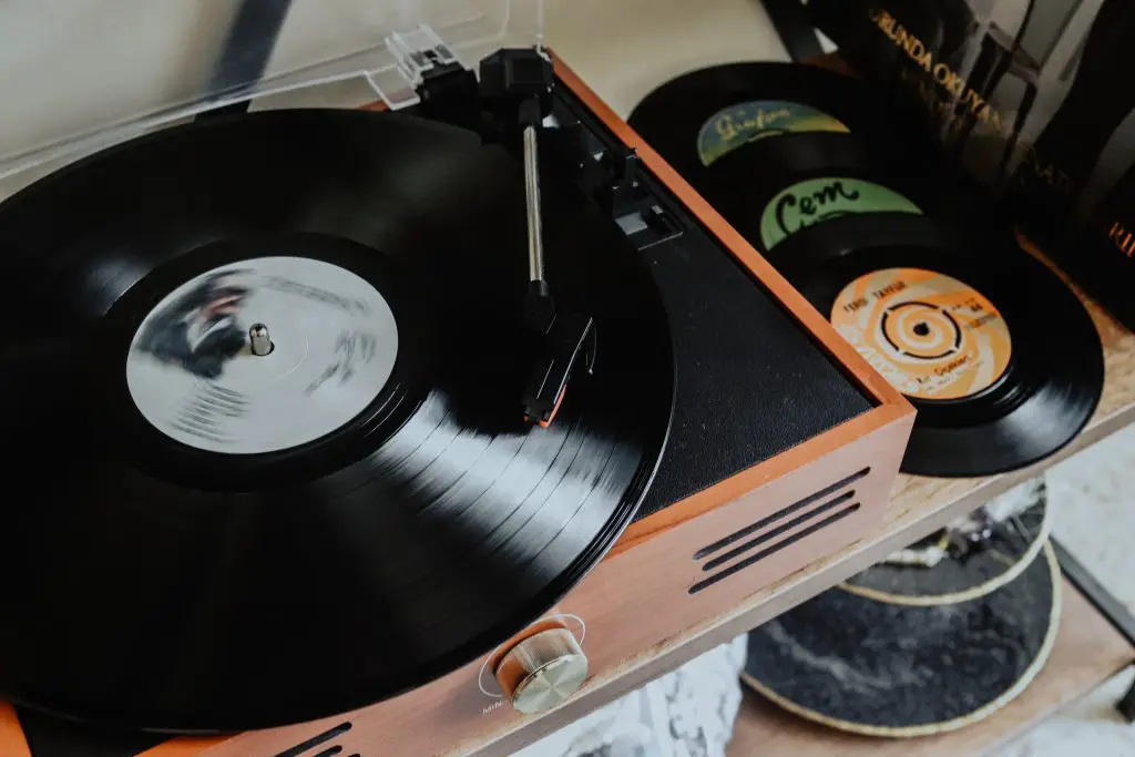 A turntable with a vinyl record playing. Source: unsplash