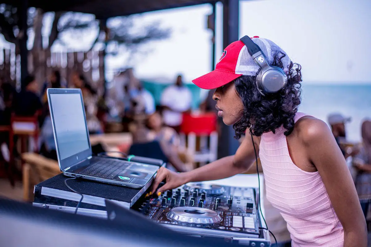 Image of a dj playing electronic music. Source: pexels