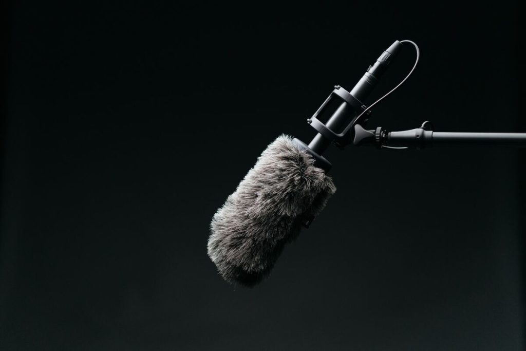 Image of a microphone with a windshield. Source: Unsplash