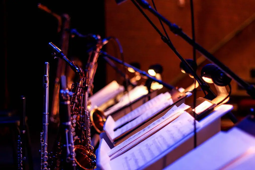 Woodwind instruments resting on a music stand. Source: unsplash