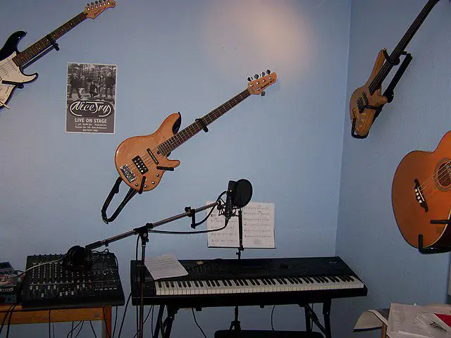 Image of guitars, keyboard, and other audio equipment.