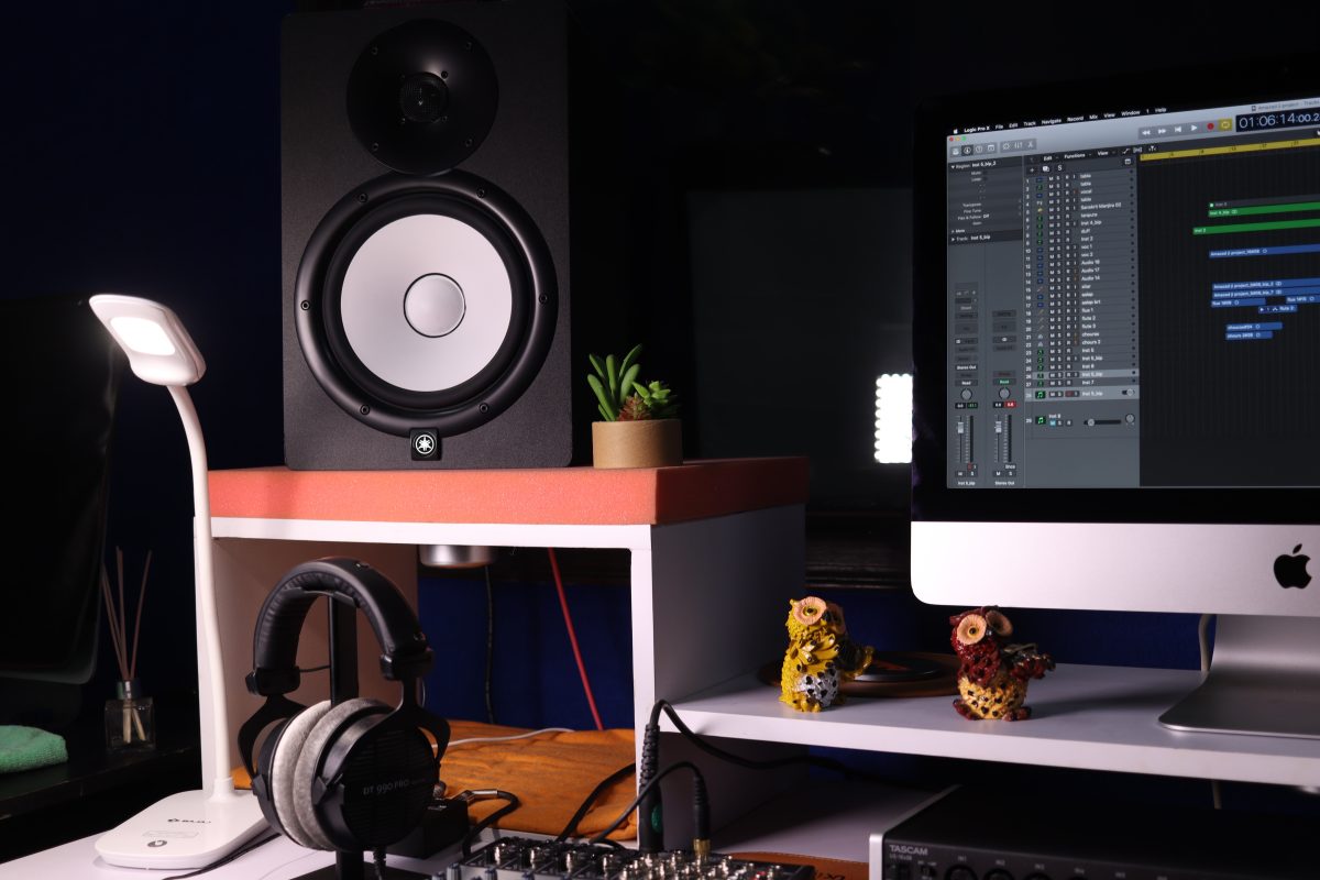 Image of a laptop and other audio equipment on a table.