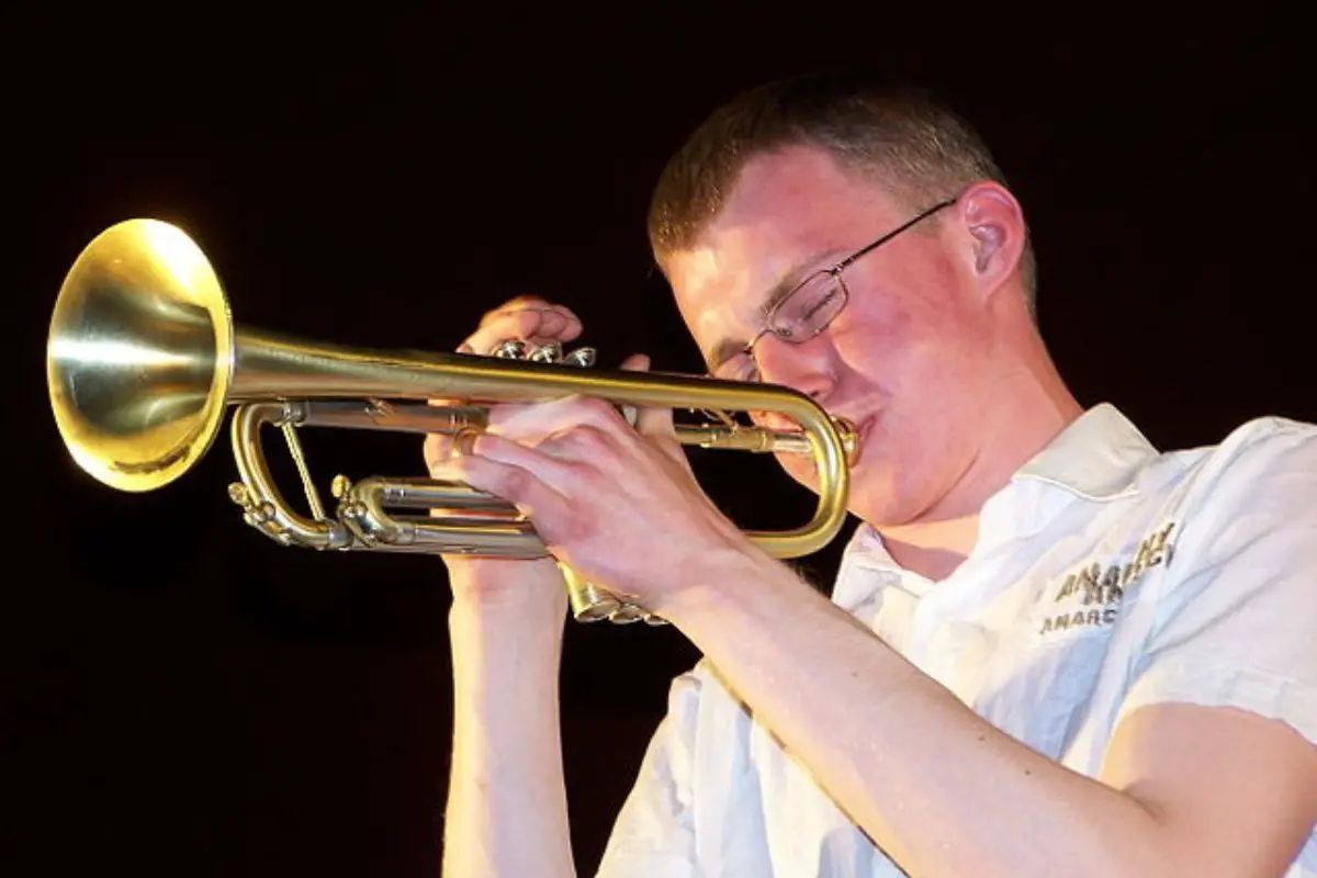 Image of a man playing a trumpet.
