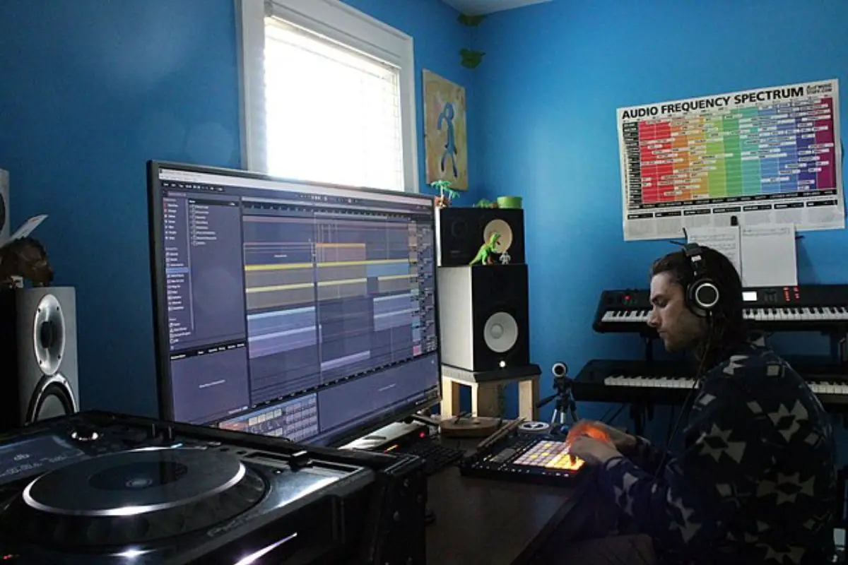 Image of a man working inside a home studio.