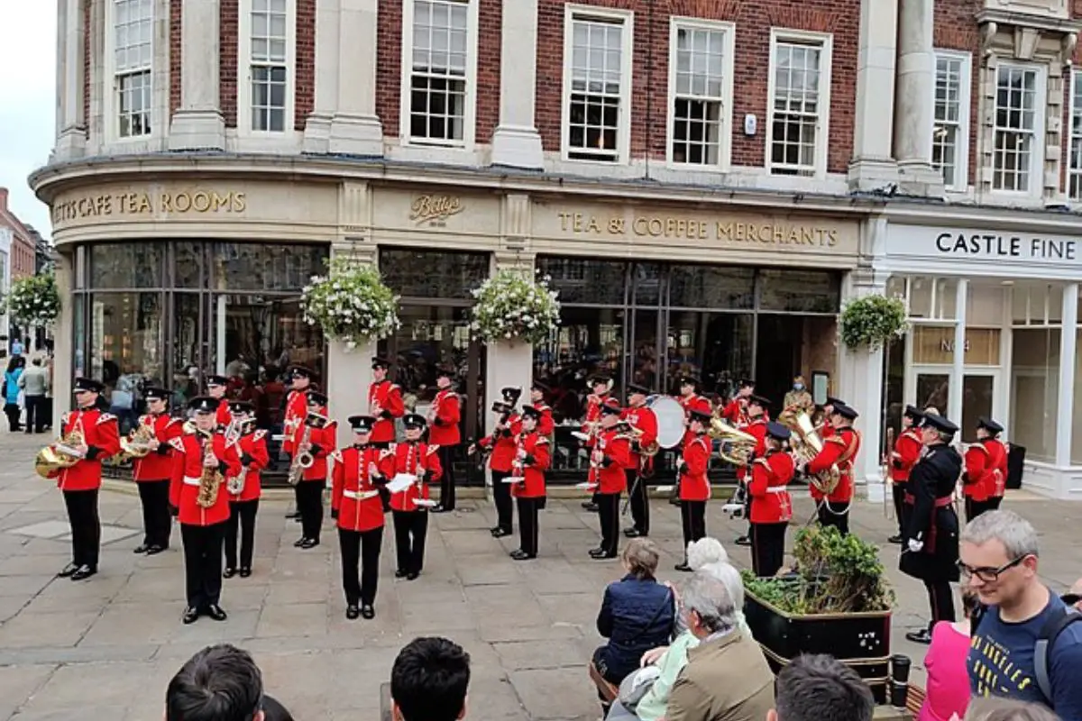 Image of a marching band performing on the street.