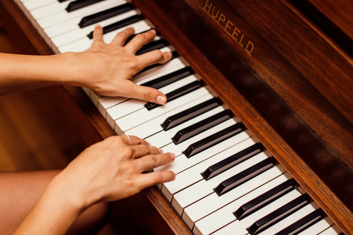 Image of a pianist playing the piano.
