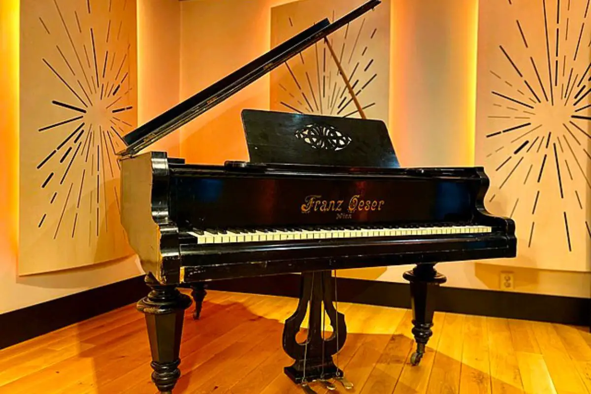 Image of a piano with bright backdrop.