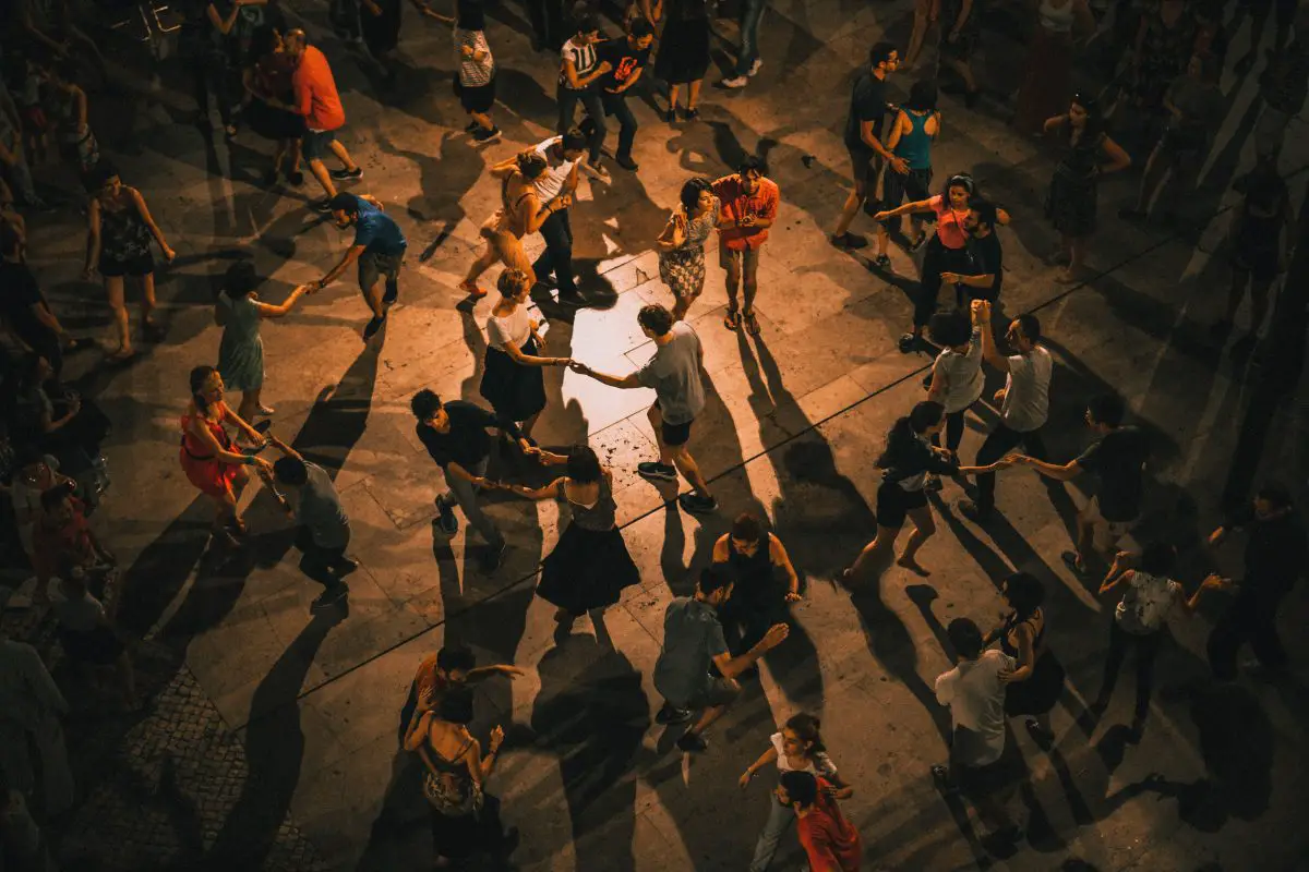 A dance floor filled with couples dancing. Source: unsplash