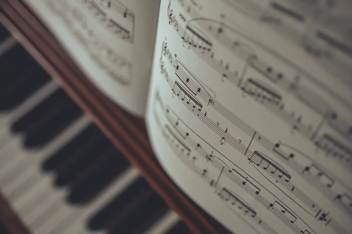 Closeup of sheet music on top of the piano. Source: unsplash