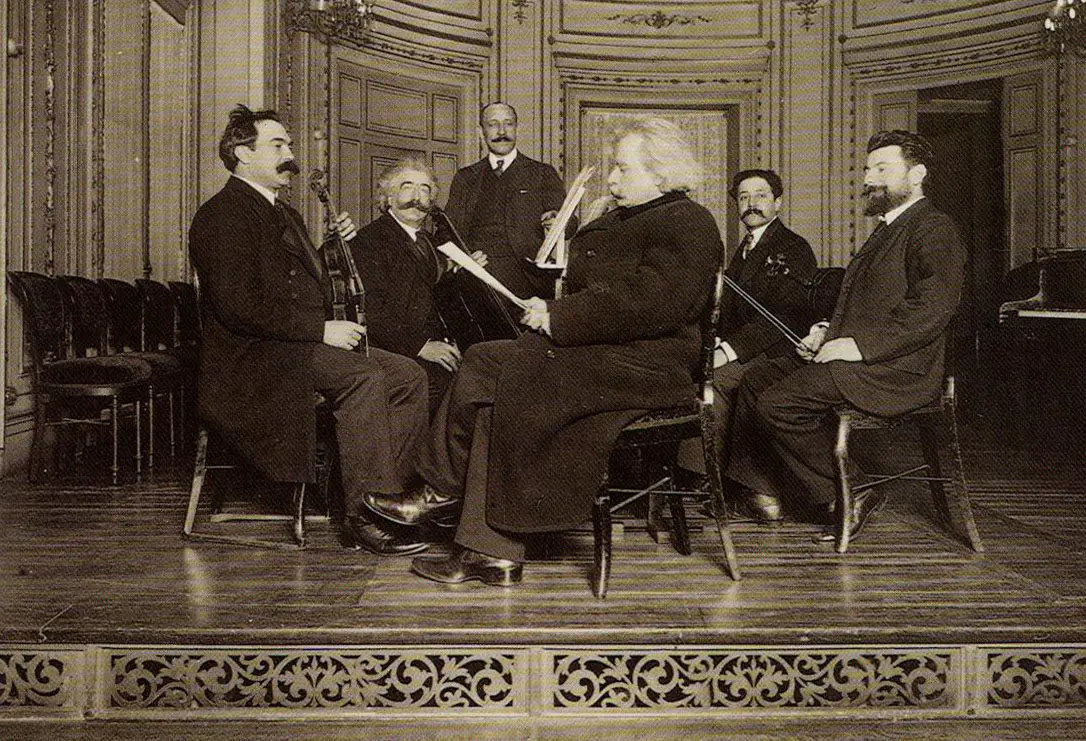 Edvard grieg with a string quartet. Source: wikicommons