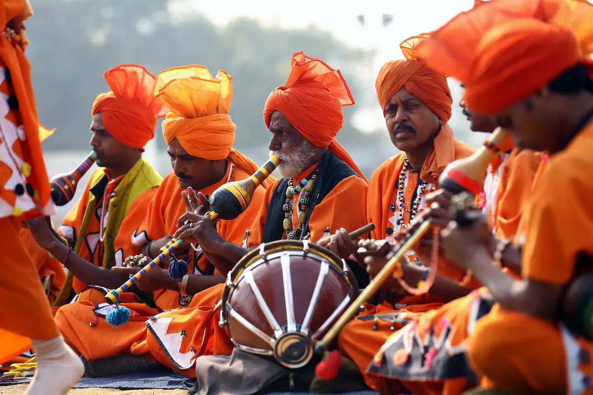 Image of a group of men playing traditional indian music. Source: pexels