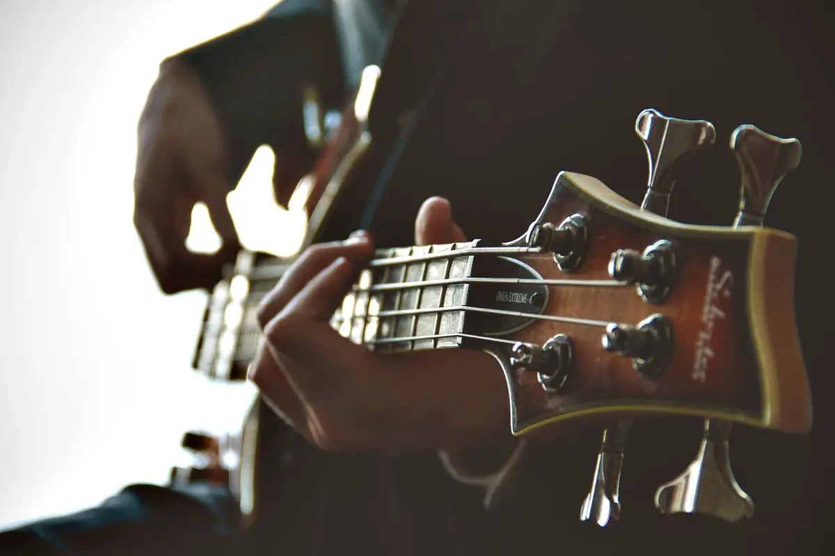 Image of a guitarist practicing music improvisation on a guitar. Source: unsplash