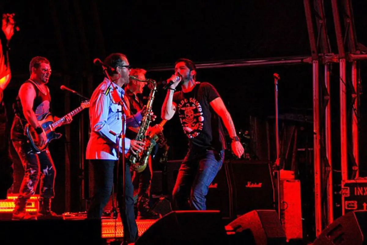 Image of a rock band having a performance on stage.